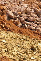 Accumulation of very dry earth with earthy colors, predominantly ocher and pink.