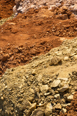 Accumulation of very dry earth with earthy colors, predominantly ocher and pink.