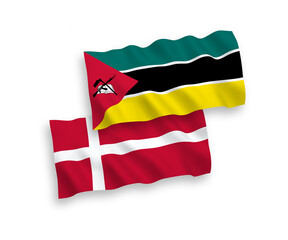 National vector fabric wave flags of Denmark and Republic of Mozambique isolated on white background. 1 to 2 proportion.