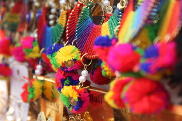 Colorful earrings in street market.