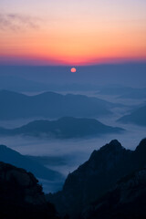 Scenic view of mountains against sky during sunrise