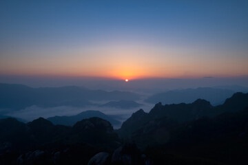 Scenic view of mountains against sky during sunrise
