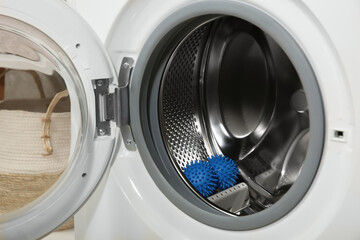 Blue dryer balls in washing machine drum