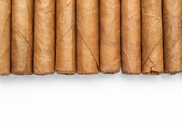 Many expensive cigars on white background, top view