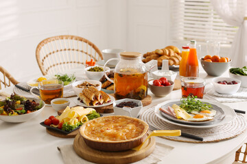 Many different dishes served on buffet table for brunch