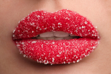 Obraz premium Young woman with beautiful lips covered in sugar, closeup