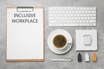 Inclusive workplace. Flat lay composition with clipboard, coffee and keyboard on grey table