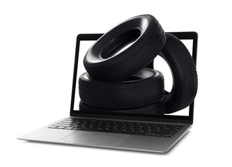 Online auto store, delivery service. Modern laptop and car tires on white background