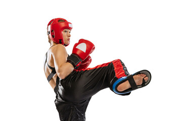Close-up female boxer in boxing gloves and helmet training isolated on white studio background....