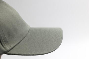 visor of grey plain cap for men isolated on a white background, side view