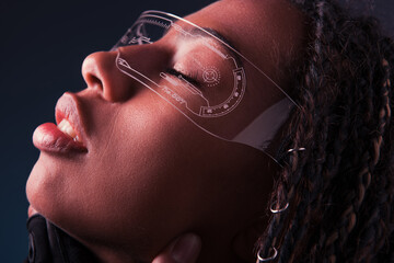 Side view of african american woman in smart glasses isolated on dark grey.