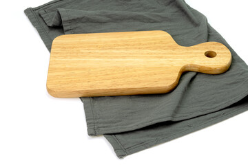 Empty wooden tray with cloth isolated on white background. Mock up. Selective focus.