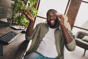 Portrait of attractive cheery skilled funky guy manager calling client discussing startup project...