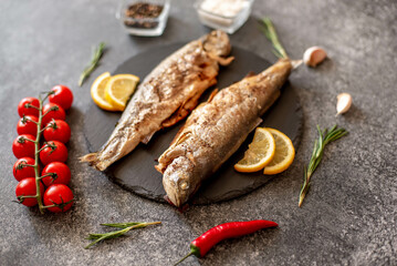 grilled trout on a stone background
