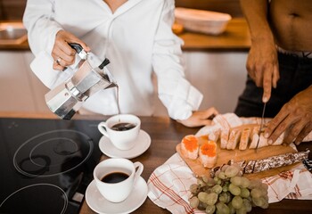 Girl pours coffee. Morning breakfast