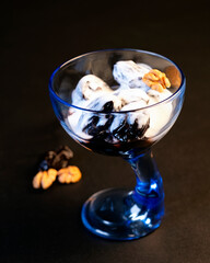 dessert prunes with nuts in a blue vase
