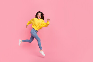 Fototapeta na wymiar Full body profile side photo of young cheerful girl rush motion jump isolated over pink color background