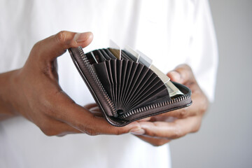 man hand taking credit card out from a wallet 