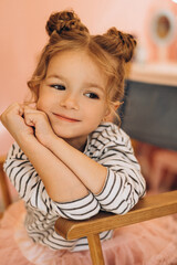 Portrait of a little beautiful girl with a stylish hairstyle in a beauty salon