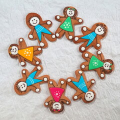 Gingerbread men lead a round dance. A symbol of friendship. Table Top Photo