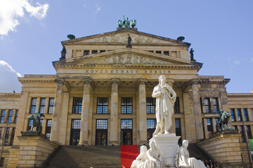 Fototapeta na wymiar Schiller Monument in front of Concert Hall (Konzerthaus Berlin) in Berlin, Germany