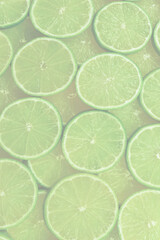 Fresh lime slices as a background.