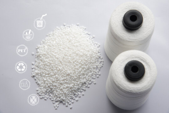 White Pet Chips Semi Dull,PET chips recycle,PET polyester chips and Raw White Polyester FDY Yarn spool with white background. Recycle icon, sustainable icon and Bottle icon.Chemical concept.