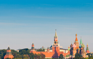 Fototapeta premium Spasskaya Tower and Cathedral of Vasily the Blessed (Saint Basil's Cathedral) on Red Square. Sunny summer morning. Moscow. Russia