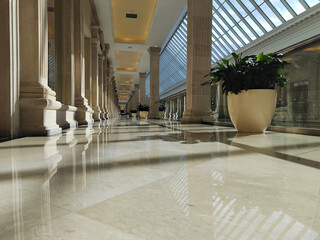 Shining floor marble reflection. empty hall in the modern office building