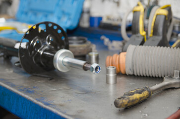 Auto mechanic working on car engine in mechanics garage. Repair service. authentic close-up shot 