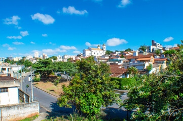 Fototapeta na wymiar Residential panorama with trees, blue sky, clouds in the city of Belo Horizonte.