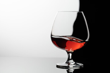 Splash of brandy in a snifter glass.