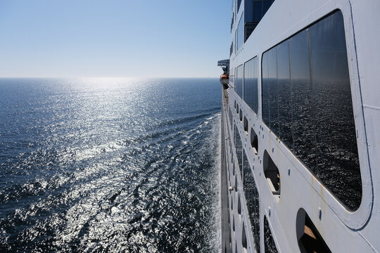 Fototapeta View from open decks of legendary luxury ocean liner  cruise ship on sunny day twilight sunset passage during Transatlantic Crossing from Southampton to New York