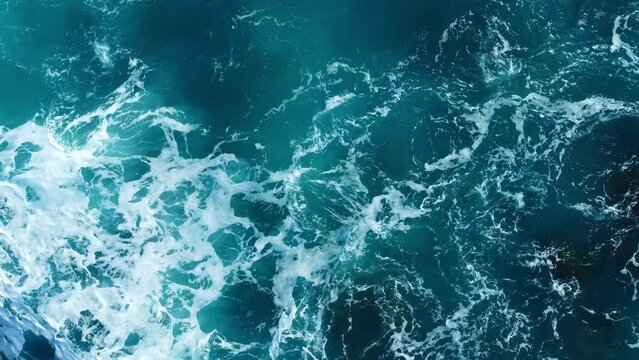 Pure blue Ocean water waves with light reflections at Slow motion, Powerful storm on the sea