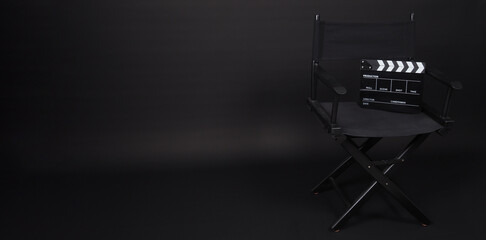 Black Director chair and Clapperboard or movie slate .IT use in video production or movie and...