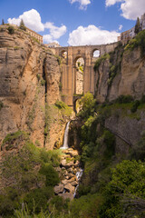 Scenic view of an old stone bridge over the canyon in Ronda, Spain at Puente Nuevo Bridge, Arch, Andalusia, Spain
