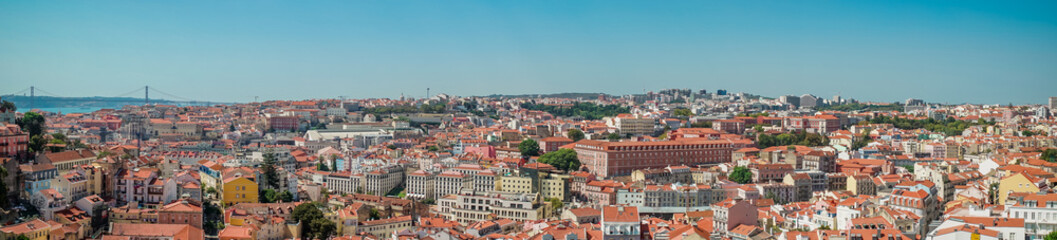 Naklejka na ściany i meble panoramic view of the Ponte 25 de Abril Bridge and the city of Lisbon.