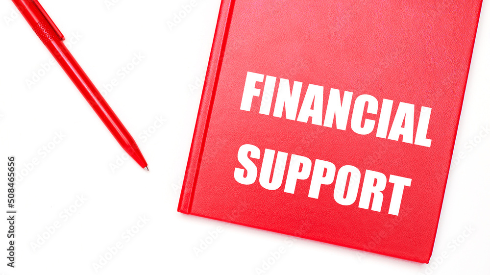 Poster the text financial support is written on a red notepad near a red pen on a white table in the office