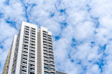 Fototapeta premium Facade of a modern skyscraper. Сonstruction industry. Sale and rental of real estate.