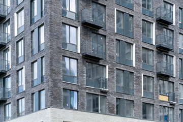 Facade of a modern skyscraper. Сonstruction industry. Sale and rental of real estate.