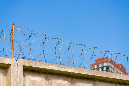 Barbed wire in the prison. Restriction of freedom.
