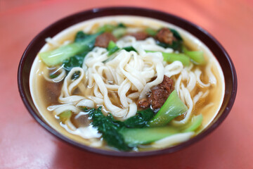 A bowl of traditional Beijing beef noodle soup    