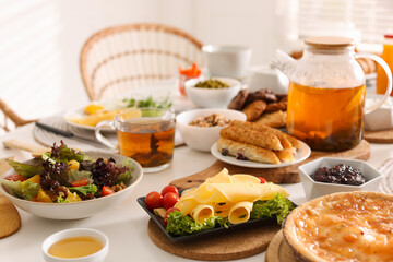 Many different dishes served on buffet table for brunch