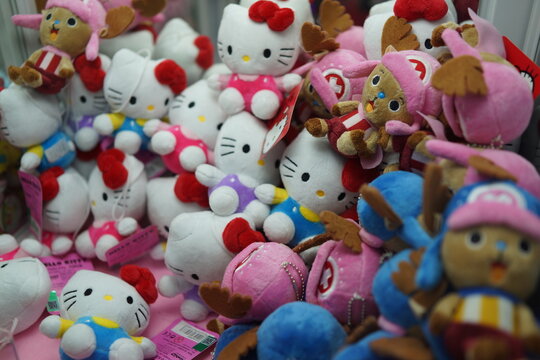 BEIJING, CHINA - JUNE 7, 2017 : Hello Kitty dolls claw crane game machine at game center. The soft toys sold in coin operating machine by using joystick to control the clamp to pull the toy up.