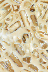Cold coffee and ice cubes,Coffee texture and macro ice cubes,Close-up of Cold latte drink with ice cubes