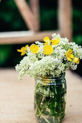 Still life with wild flowers, outdoor photo, bokeh style.