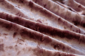 Pink silk velvet textile fabric, abstract background, close-up
