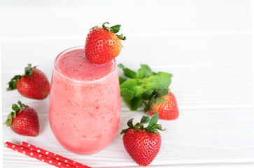 Strawberry yogurt fruit juice smoothie pink colorful fruit juice milkshake blend beverage healthy high protein the taste yummy In glass drink episode morning on white wood background.