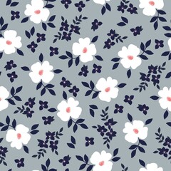 Simple vintage pattern. white flowers and small dark blue leaves. gray background. fashionable print for textiles, wallpaper and packaging.