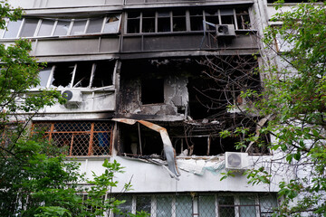 Fototapeta na wymiar Damaged multi-apartment skyscrapers Russian planes and bombs.